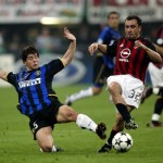 Cristian Brocchi of AC Milan and Emre Belozoglu of Inter Milan