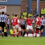 Paolo Di Canio of Sheffield Wednesday tussles with Martin Kweown of Arsena