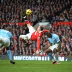Robin Parker, FotoSports_ Wayne Rooney scores an overhead kick against Manchester City
