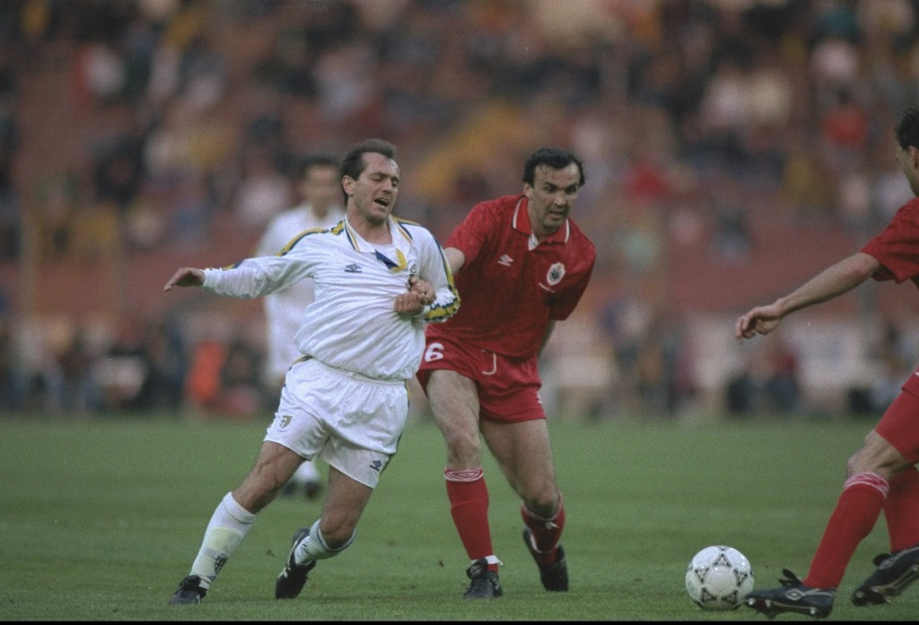 Stefano Cuoghi of Parma is tackled by Dragan Jokovljevic of Antwerp
