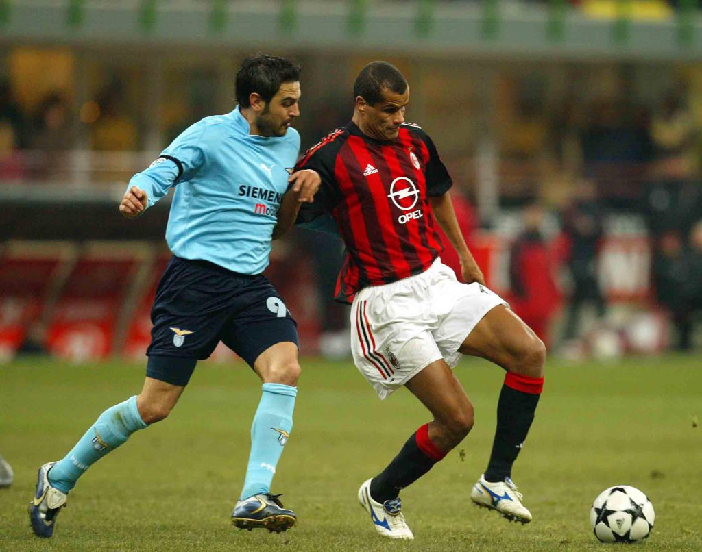 Rivaldo of AC Milan and Stefano Fiore of  Lazio in action